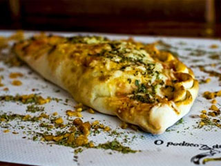 O pedaço da pizza amplia seu cardápio com deliciosas opções de calzone